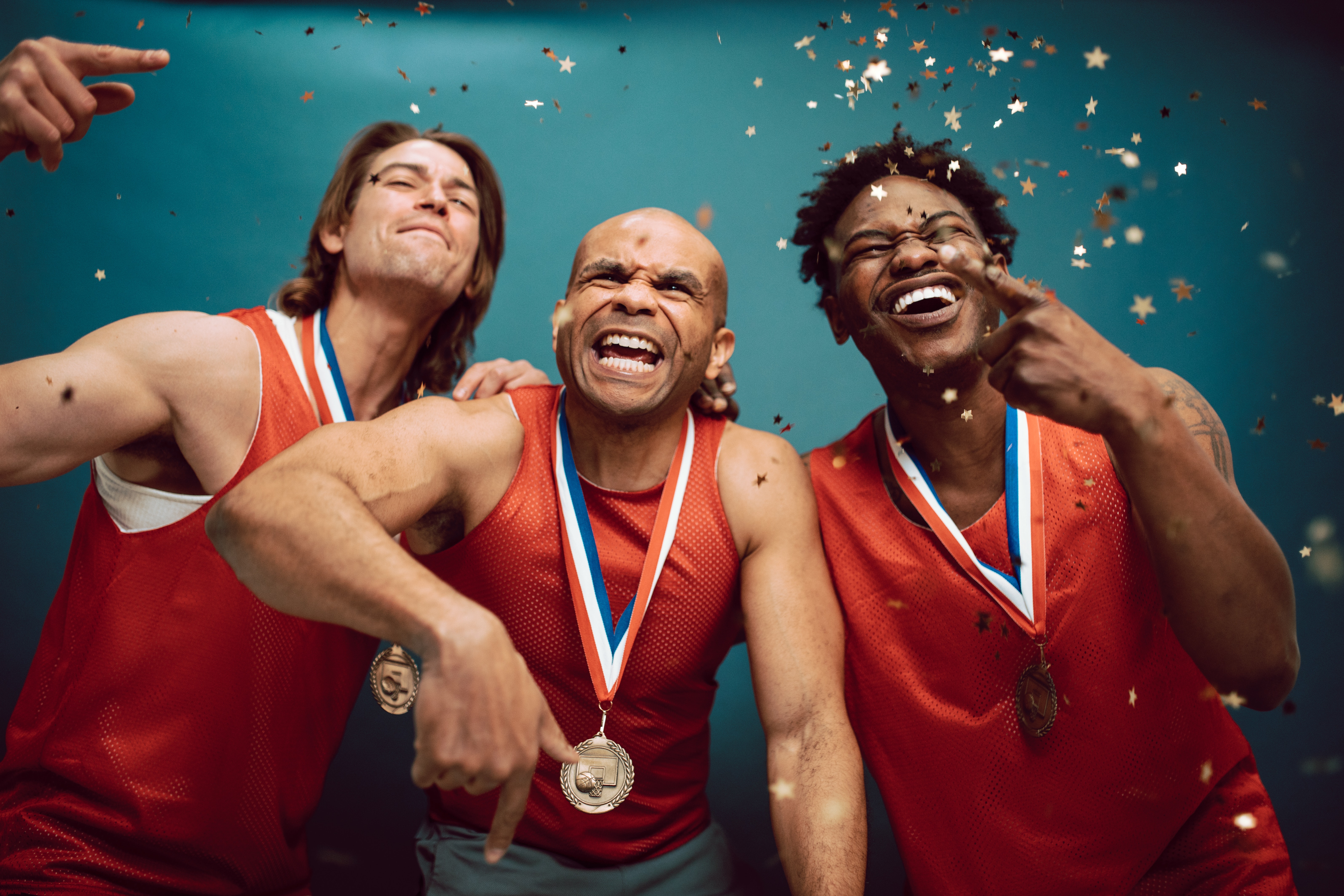 Confetti Falling on Proud Team Wearing Medals