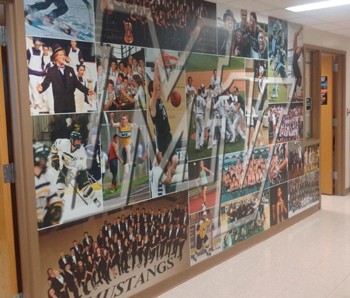 collage of photos of student-athletes on a wall